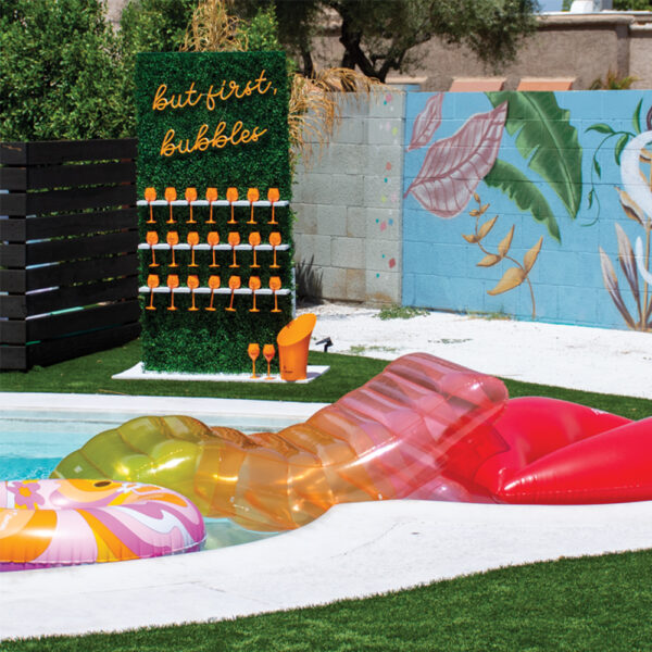 Brides and Baches champagne wall add-on by pool.