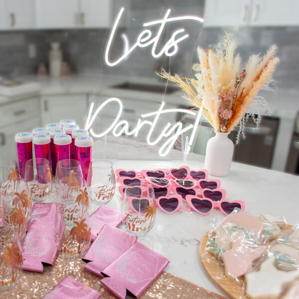Boho Bach bachelorette theme includes table top cookies, bride straw, kookie, neon sign, and hangover kit.