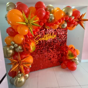 Her Perfect Match bachelorette backdrop with red shimmer wall, flame balloon garland, and Scottsdale neon sign